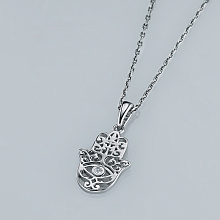Silver pendant with grown diamond